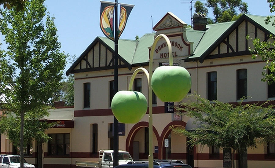 Elevation of Donnybrook post offic from oval with two large apple lights in foreground